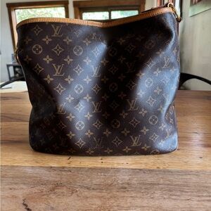 LV Delightful bag. You can see where it has worn off on the one side.